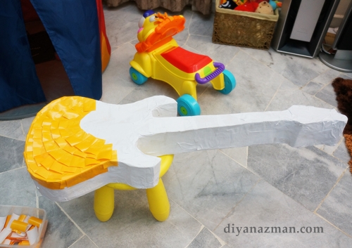 yellow pinata guitar for party