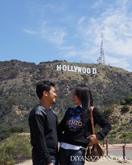 couple in hollywood sign los angeles california